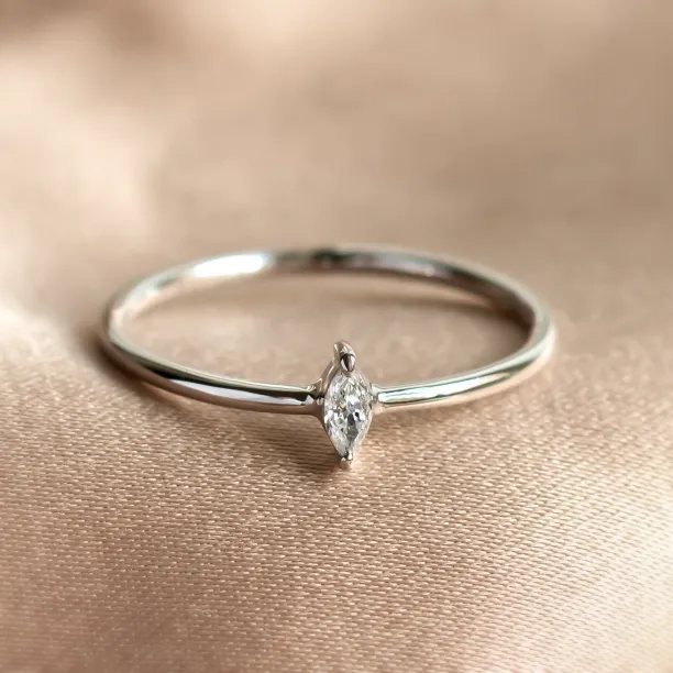 Close-up of the ANTOINE engagement ring with a marquise lab-created diamond