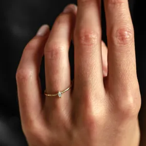 ANTOINE engagement ring with a marquise lab-created diamond worn on a hand