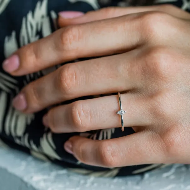 Angled view of the ANTOINE ring with a marquise lab-created diamond worn on the hand