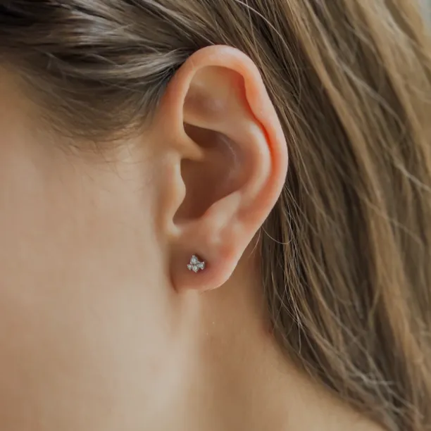 STEPH gold diamond cluster earring worn on the ear