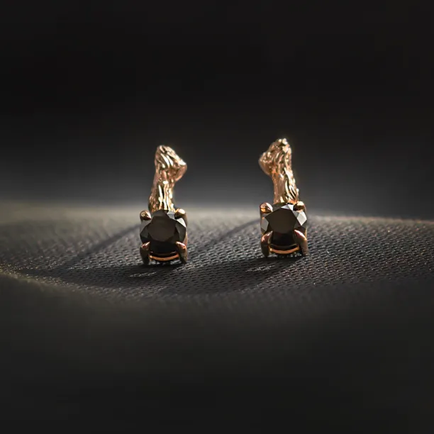 Pair of SEAN gold stud earrings with black diamonds and twig design