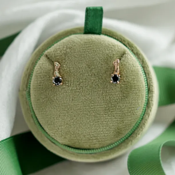 SEAN gold stud earrings with black diamonds displayed as a pair