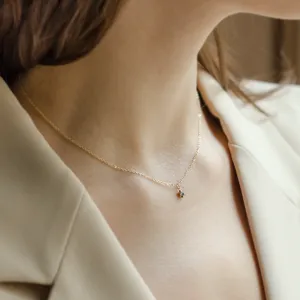 CADIE gold pendant with salt and pepper diamond worn on the neck