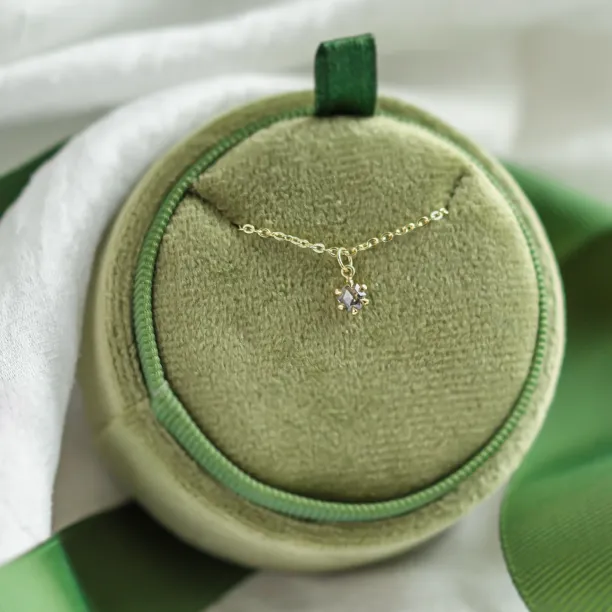 CADIE gold pendant with salt and pepper diamond displayed with its chain