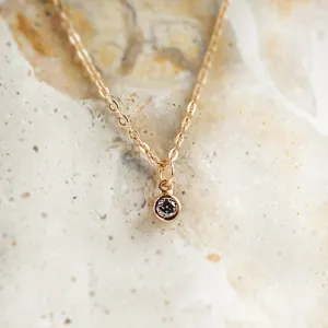 Gold SAND pendant necklace with a bezel-set salt and pepper diamond