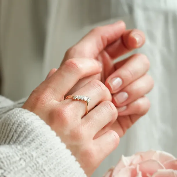 FRANCES gold ring with five baguette moissanites worn on the hand