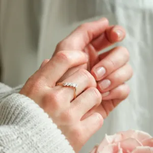 FRANCES gold ring with five baguette moissanites worn on the hand