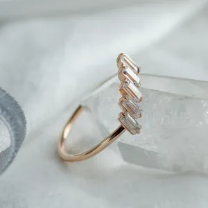 Angled close-up of the FRANCES ring showing its baguette moissanite setting