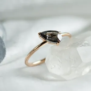 ALIA engagement ring showing the faceted pear-shaped salt and pepper diamond