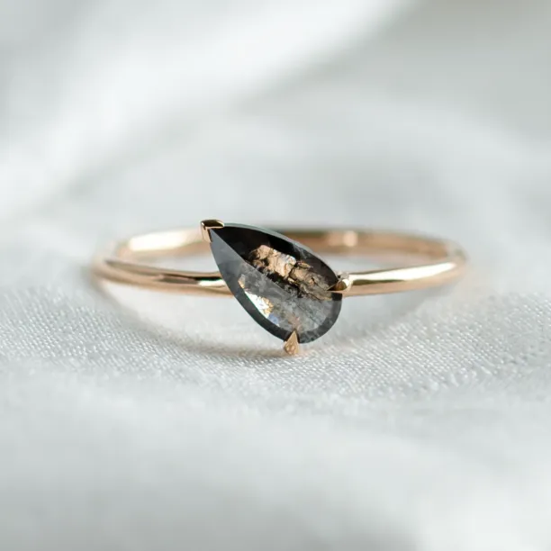 ALIA engagement ring with pear-shaped salt and pepper diamond, close-up