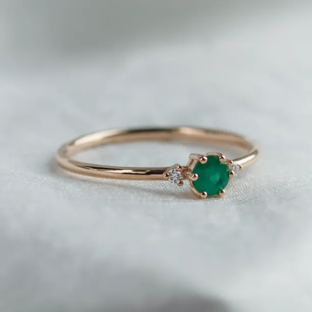 Engagement ring with emerald and side diamonds AVA Image
