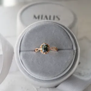 BAROQUE gold ring with green sapphire and diamonds displayed from above