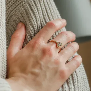 Gold vintage ring with a hexagon sapphire and diamonds worn on the finger