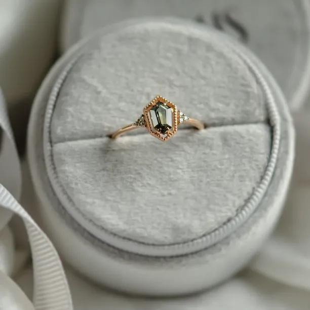 Gold vintage ring with a hexagon sapphire and diamond side accents
