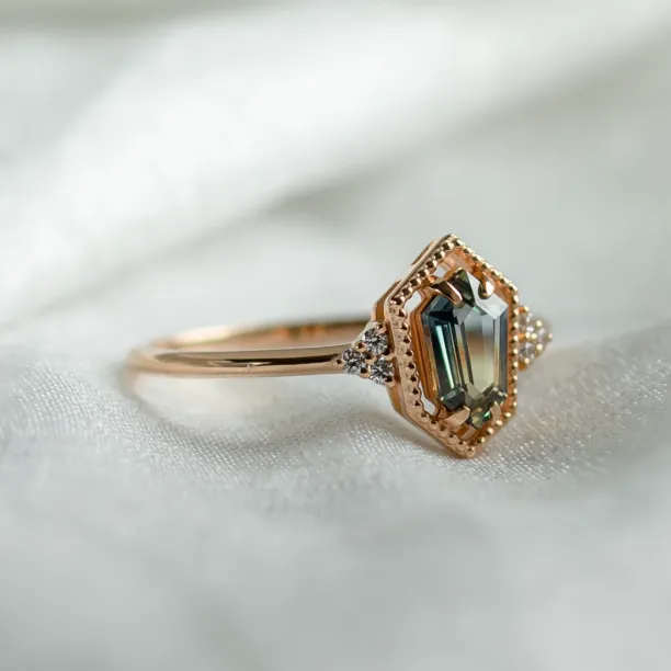 Angled view of the gold vintage ring with a hexagon sapphire and diamonds