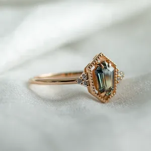 Angled view of the gold vintage ring with a hexagon sapphire and diamonds