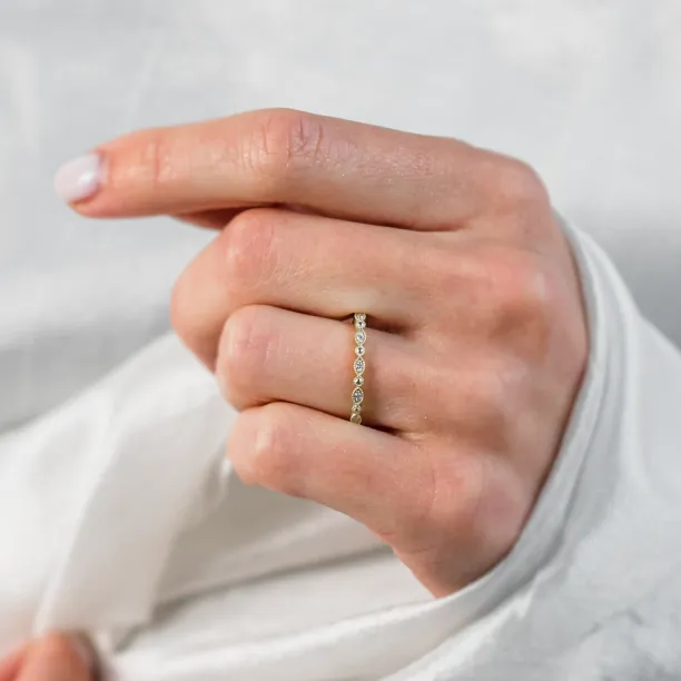 HONEY diamond wedding ring worn on a hand