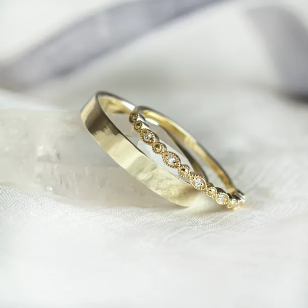 Angled view of HONEY diamond wedding rings