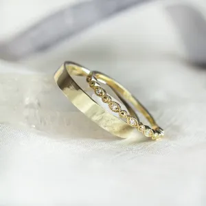 Angled view of HONEY diamond wedding rings