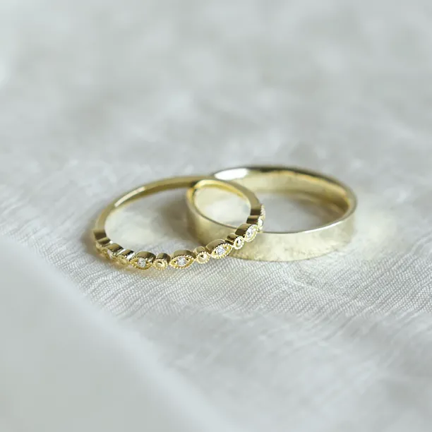 HONEY diamond wedding rings shown together in an angled view