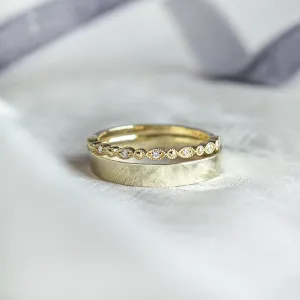 HONEY wedding rings with a diamond eternity band in close-up
