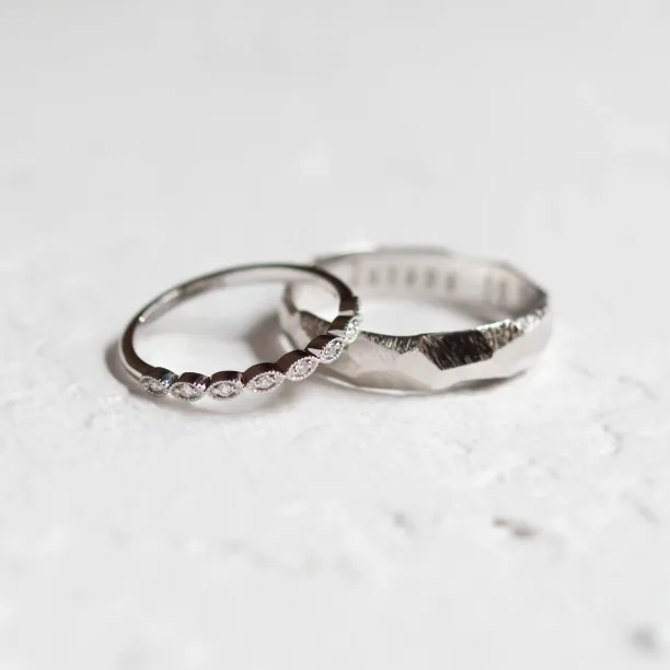 White gold DARLING diamond wedding bands in an angled view