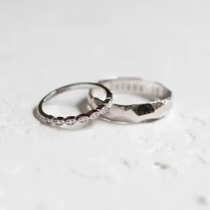 White gold DARLING diamond wedding bands in an angled view