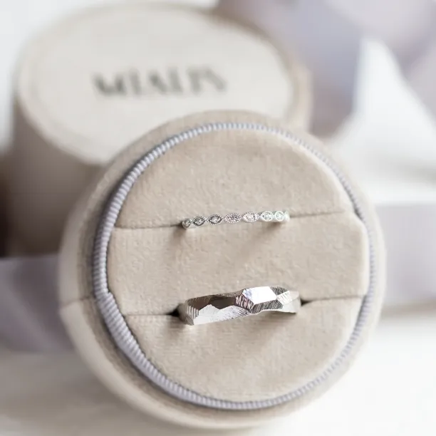 DARLING diamond wedding bands displayed together, showing the hammered band