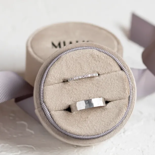 Wedding ring pair with a diamond eternity ring and hammered band