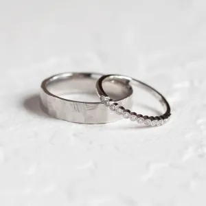 PAIR diamond wedding rings, showing a hammered band and diamond eternity ring