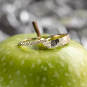 Angled view of the PAIR wedding rings with diamonds