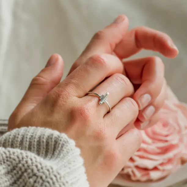 ETHEL engagement ring with central baguette moissanite worn on the hand