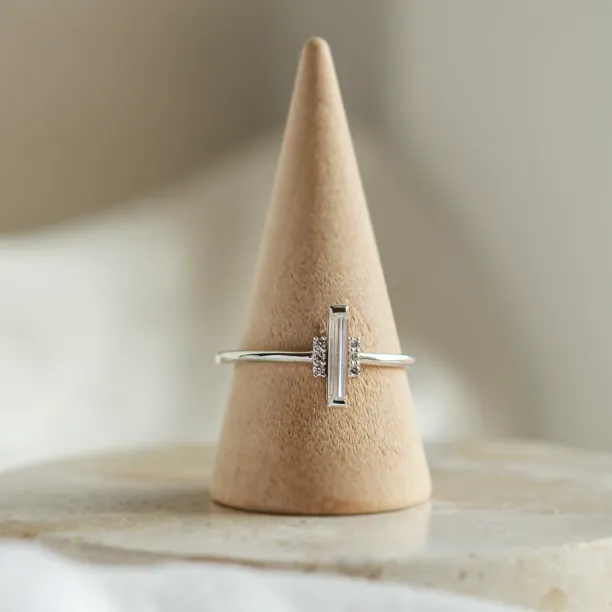 Angled view of the ETHEL ring with its central baguette moissanite