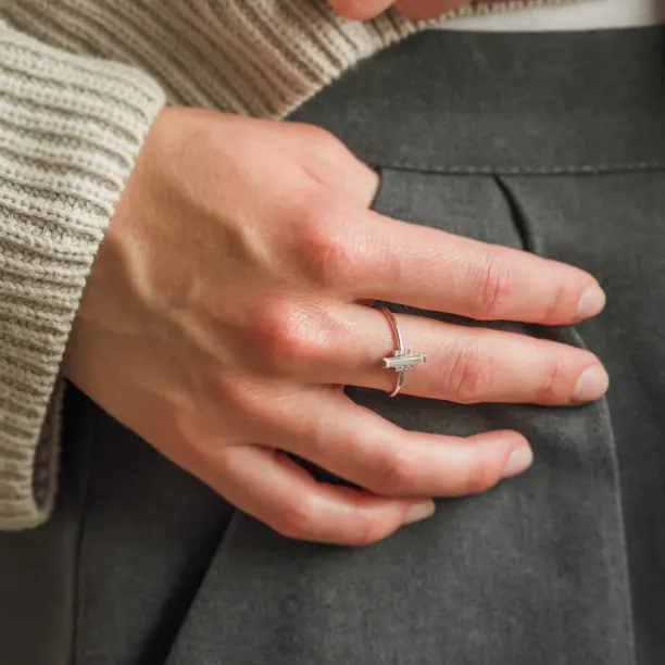 ETHEL engagement ring with central baguette moissanite worn on a finger