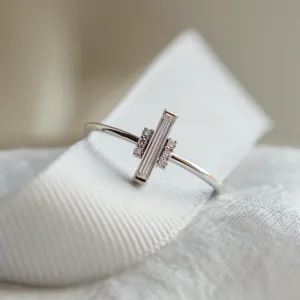 Close-up of the ETHEL ring showing its central baguette moissanite