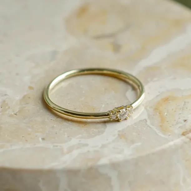 Angled view of the HANNAH minimalist diamond ring