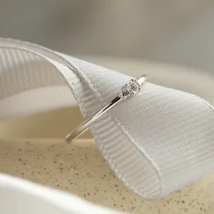 Close-up of the diamonds and slender band on the ring