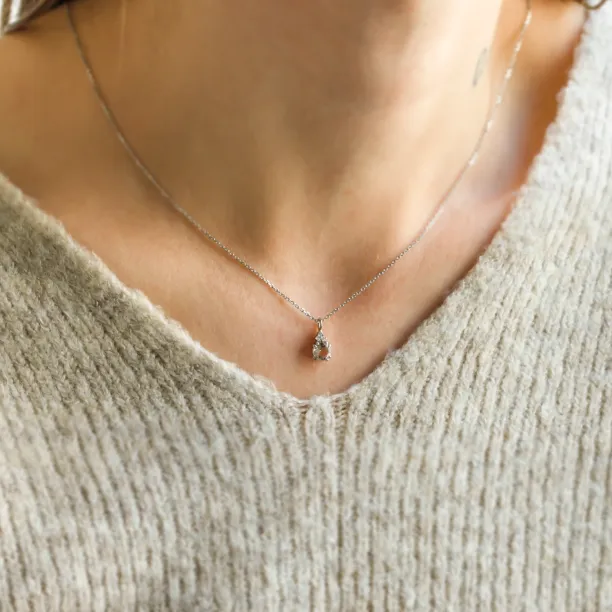 FEMINA gold necklace with morganite and side diamonds worn on the neck