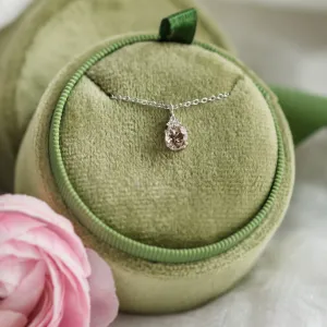 Close-up of FEMINA gold necklace with morganite pendant and side diamonds