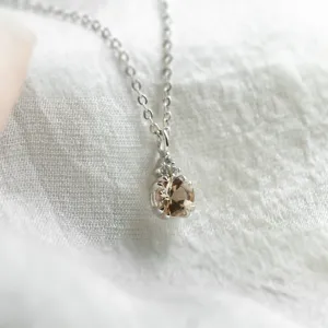 Close-up of morganite pendant and side diamonds on FEMINA gold necklace