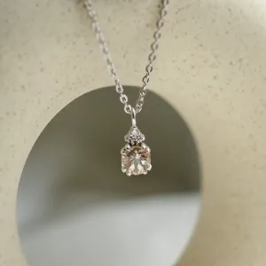 Detailed view of FEMINA morganite pendant with side diamonds