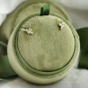 Gold diamond cluster earrings displayed as a pair