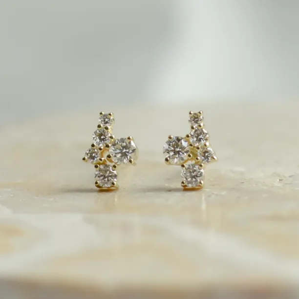 Front-facing pair of gold diamond cluster earrings