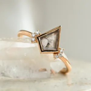 Angled close-up of the KAREN ring with a kite-shaped salt and pepper diamond