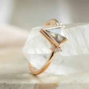 Close-up of the KAREN ring showing its kite-shaped salt and pepper diamond