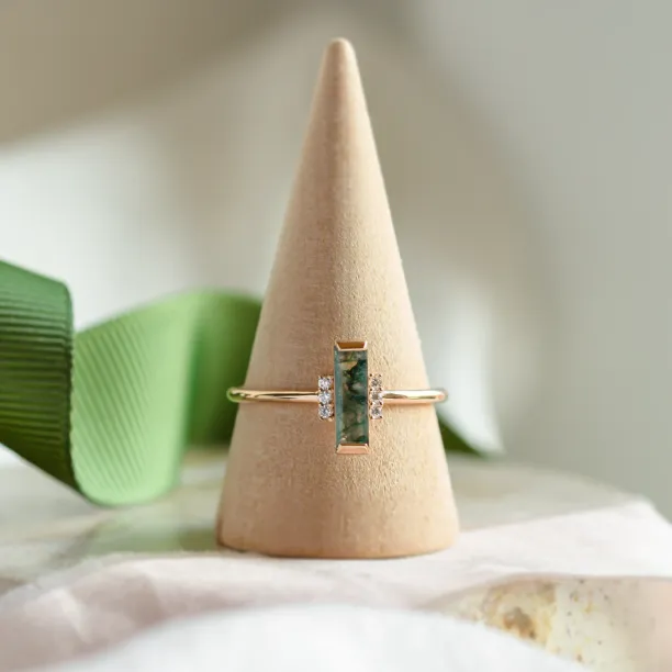 BRONTE engagement ring with baguette moss agate and diamonds displayed upright