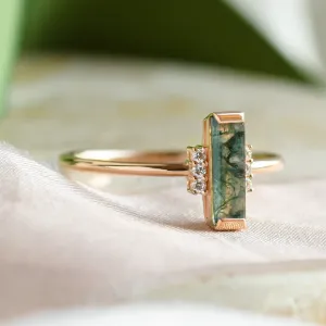 Close-up of the BRONTE ring’s baguette moss agate and diamond details
