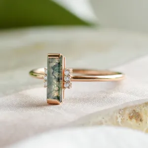 Side view of the BRONTE ring with baguette moss agate and diamonds