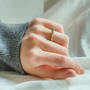 MILA engagement ring with baguette moss agate and diamonds worn on a hand