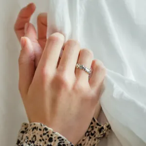 NALANI organic wedding ring worn on a hand